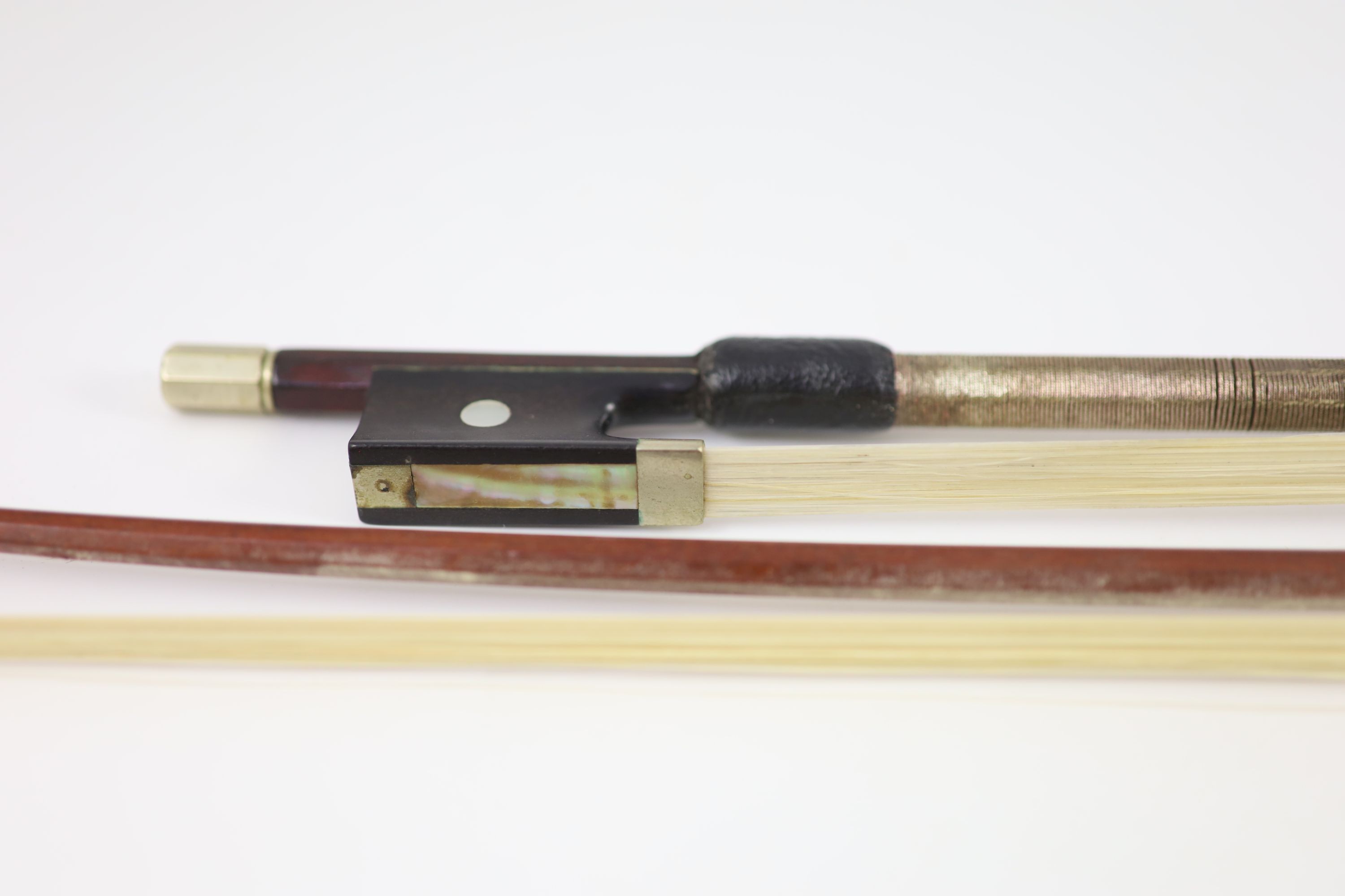 Two stamped violin bows, Both 74.5 cm long